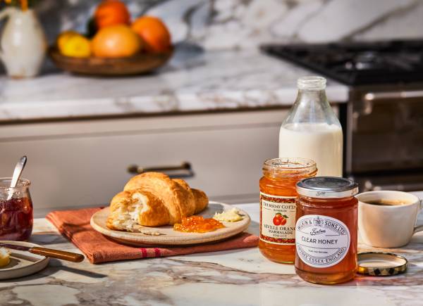 breakfast pastries, milk, jam and honey
